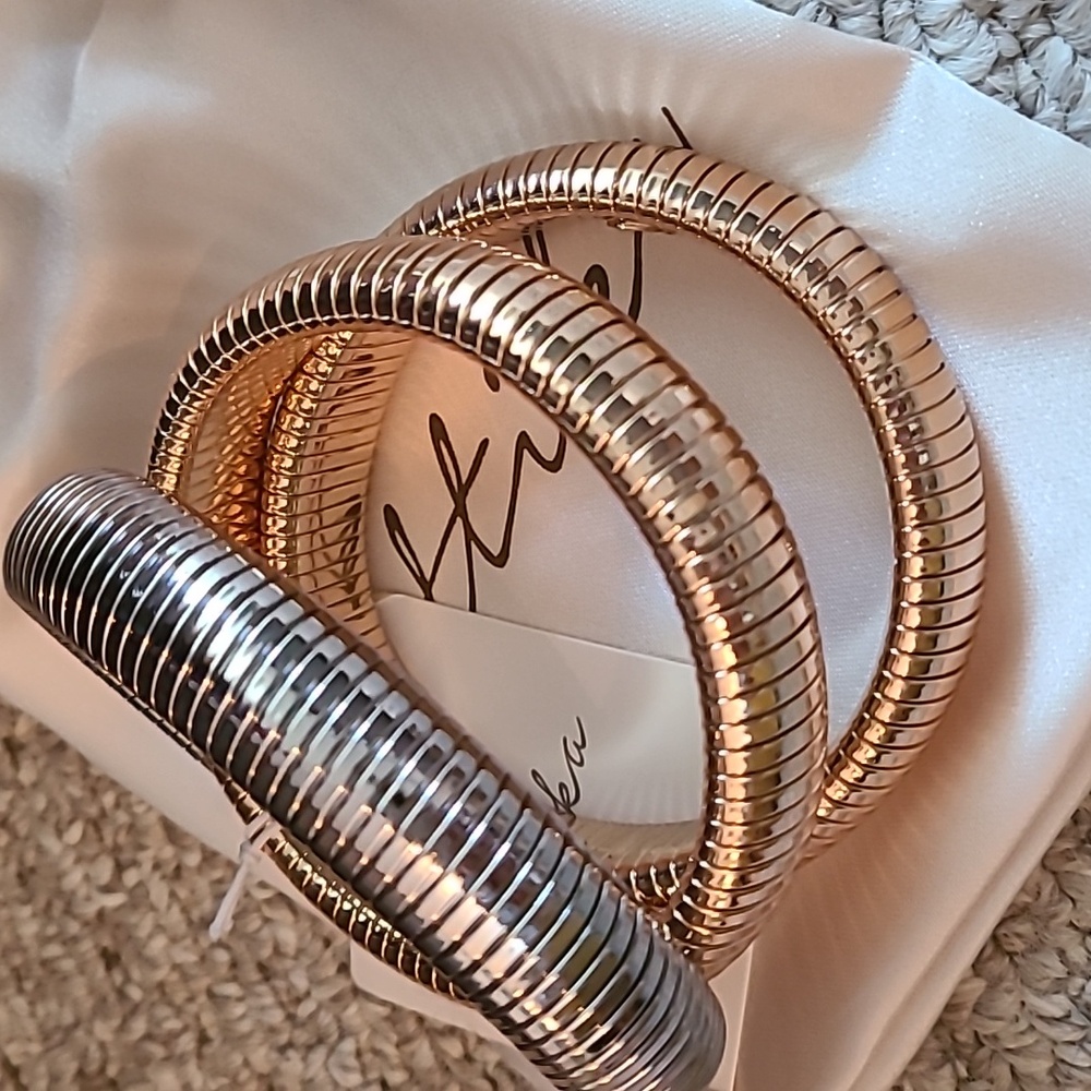Set of 3 flexible bangles by Ettika, 2 gold 1 silver - great stacked or alone